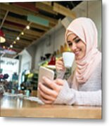 Muslim Woman At A Cafe Texting On Her Mobile Phone Metal Print
