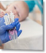 Pediatric Nurse Holds Many Syringes During Baby's Well Check Appointment Metal Print