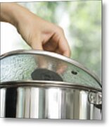 Person Removing Lid From Cooking Pot Metal Print