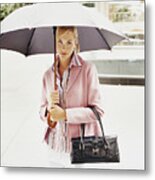 Portrait Of A Young Woman Holding An Umbrella In The City Metal Print