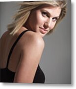 Portrait Of Young Caucasian Blonde Woman In Black Tank Top Looks Over Shoulder Flirts With Camera Metal Print
