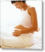 Pregnant Woman Looking At Her Stomach Metal Print