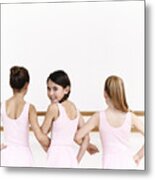Rear View Of A Line Of Young, Female Ballet Dancer Practicing In The Dance Studio With One Ballerina Looking Behind Her Metal Print