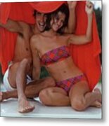 Smiling Couple Sitting Together Under A Towel Metal Print