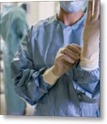 Surgeon Adjusting Medical Gloves In Hospital, Mid Section Metal Print