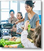 Thai Family Portrait Having Fun At The Joint Cooking. Modern Style Interior Of Kitchen. Metal Print