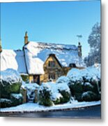 Thatched Country Cottage In The Snow Metal Print