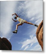 Woman Jumping Over Rock Ledge Metal Print