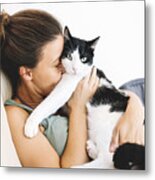 Woman Sitting On The Sofa Hugging Her Cat Metal Print