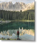 Woman Standing And Looking At  Lago Di Carezza In Dolomites Metal Print