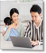 Young Asian Family Using Laptop In Kitchen Metal Print