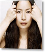 Young Asian Woman Holding Hair Back From Her Face Metal Print