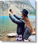 Young Beautiful Female Backpacker Doing Pictures On Her Phone Metal Print