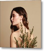 Young Beautiful Girl And Plant Metal Print