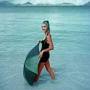 A Model In The Sea With An Umbrella Poster