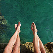 Couples Legs Above Turquoise Ocean Poster