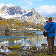 Hiker Taking Pictures Of Alaska Mountain Range. Poster