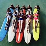 Models Wearing Bikinis Lying On Surfboards Poster