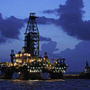 Oil Rig And Vessel At Night Poster