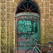 Old Bicycle In Front Of A Weathered Poster