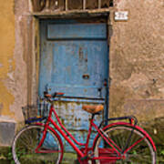 Old Red Bicycle Leaning Against A Poster