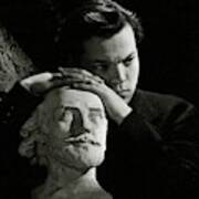 Orson Welles Resting On A Sculpture Poster