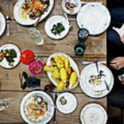 Overhead View Of Friends Dining Mid-meal Poster