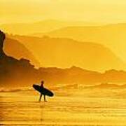 Surfer Entering Water At Misty Sunset Poster