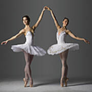 Two Ballerinas Performing Relevé On Poster