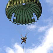 A Paratrooper Jumps From A Ch-46 Sea Poster