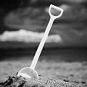 Childs Toy Plastic Spade Stuck Into The Sand On A Beac Poster
