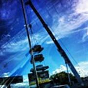 Vintage Cars Hanging From A Crane Poster