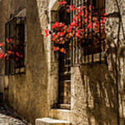 A Barred Window And Door With Red Begonia And Contrasty Shadows Saint Paul De Vence France #2 Poster