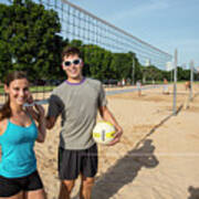 Young Fit Couple On The At The Zilker Park Sand Volleyball Courts With Volleyball On Sunny Summers Day #2 Poster