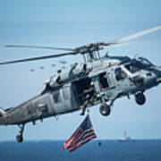 An Mh-60s Sea Hawk Helicopter Displays The American Flag. Poster