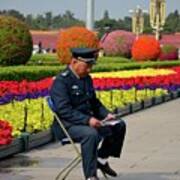 Chinese Security Guard Reads In Front Of Flower Display Beijing China Poster