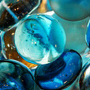 Glass Marbles In Blue Water Poster