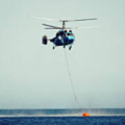 Helicopter Firefighter Take Water In The Sea Poster