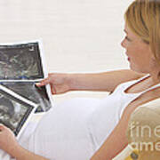 Pregnant Woman Looks At Ultrasonounds Poster