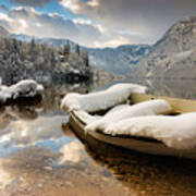 Snow Covered Boat On Lake Bohinj In Winter Poster