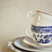 Stacked Blue And White China Cups And Saucers. Poster