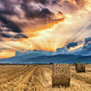 Sunset Over Farm Field With Hay Bales Poster