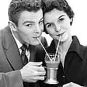 Young Couple Sharing A Milkshake Poster
