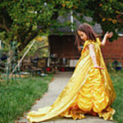 A Beautiful Child In Long Gold Dress And Cape Dances Alone Outside Poster