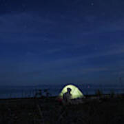 A Cyclist Camping In The Dark In Vancouver Island, Bc, Canada Poster