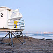 A Lifeguard Tower Sits On The Beach At Poster