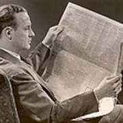 A Man Reads A Newspaper Poster