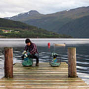 A Norwegian Working On Some Crab Pots On A Dock By The Fjord Poster