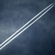 A Vapour Trail Is Seen As An Aircraft Poster