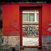 Bicycles In Red Doorway Poster